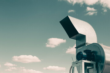 Batch of industrial exhaust snail fans with installed electric motors for air ventilation in a factory open-air warehouse storage area awaiting transportation. © Torkhov