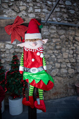Christmas elf figure displayed at holiday market