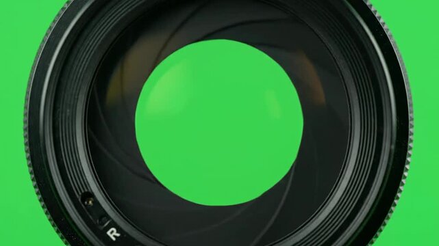Camera lens aperture diaphragm opening and closing macro close up with green screen chroma key background
