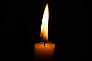 A detailed macro photograph of a candle flame, capturing the warm glow, delicate flicker, and atmospheric texture of burning wax. Perfect for themes of calm, spirituality, ambiance, and fine art.
