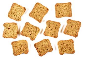 Set rusks with wholewheat flour, sliced whole wheat dry bread isolated on white background, top view