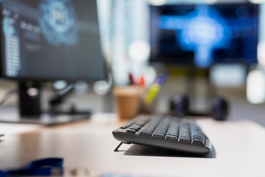 Close up of keyboard in AI startup office used by programmers employing artificial intelligence applications to run code. Computer peripherals used for writing IT scripts in tech industry workspace - Powered by Adobe