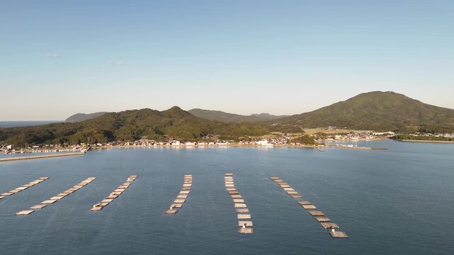 Shimakishi, Itoshima, Fukuoka, Japan Coastline in Autumn: 4K Aerial Drone Footage of Hikizu Bay, Rural Beach, Islands, Mountain Forests, Fish Cage, Houses, Estates near Genkai Quasi-National Park