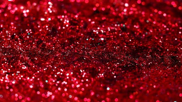 Red glitter abstract background with sparkling bokeh lights.