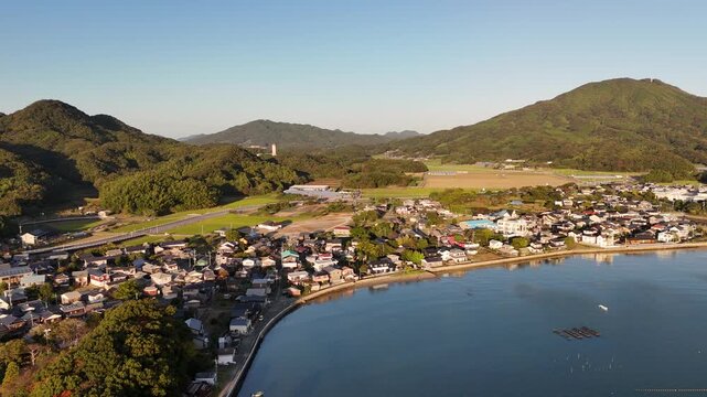 Shimakishi, Itoshima, Fukuoka, Japan Coastline in Autumn: 4K Aerial Drone Footage of Hikizu Bay, Rural Beach, Islands, Mountain Forests, Fish Cage, Houses, Estates near Genkai Quasi-National Park