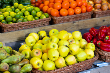 Many of fresh ripe green apples on market, puts out for sale