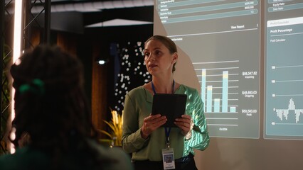 Team of company analysts review feedback on data insights to work on future improvements,...