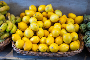 Lemons in shop window. Stocks of fruits in stores storage. Fresh fruit vegetable harvest from producer is already on store shelves.
