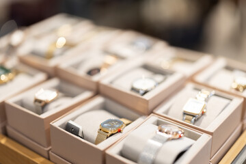 Cabinet is showcase in store of accessories and wrist watches, selection is made from local and imported brands. Illuminated counter with goods in store.