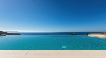 Infinity pool overlooking calm ocean and clear blue sky with minimalist terrace