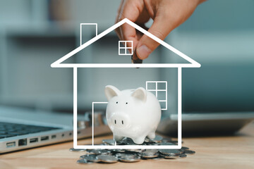 A hand dropping a coin into a piggy bank encased in a white line-art outline of a house, symbolizing the concept of saving money for a home purchase or mortgage.