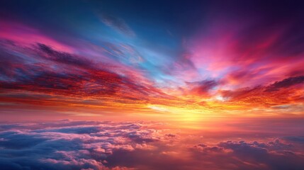 Obraz premium A beautiful sunset with a colorful sky. The sky is filled with clouds and the sun is setting. The colors of the sky are vibrant and warm, creating a peaceful and serene atmosphere