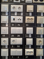 Many electric light switches in construction hypermarket