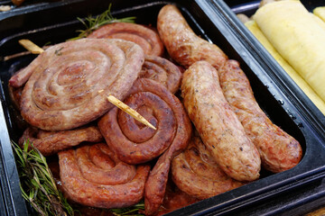 Meat sausages and frankfurters in street fastfood restaurant