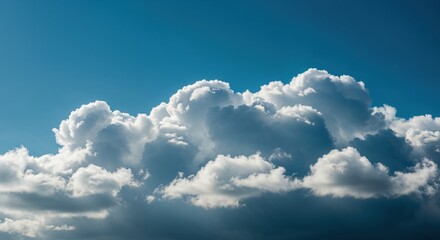 Fluffy white cumulus clouds majestically float across a vibrant blue sky, illuminated by bright sunlight creating dramatic shadows and a serene, cinematic atmosphere.