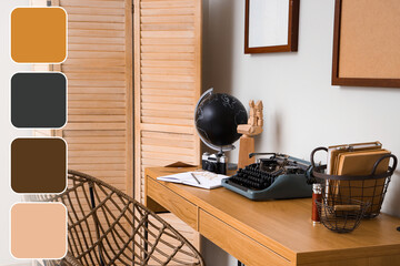 Author's workplace with vintage typewriter and globe in office