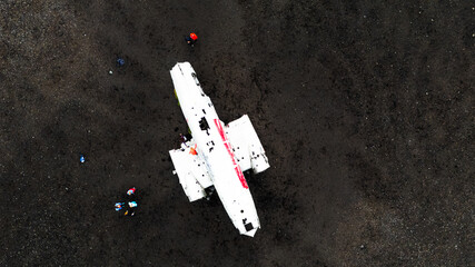 Aerial view of Wreckage of DC plane on black sand beach in Iceland a popular tourist