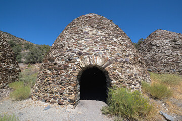 Historic Charcoal Kilns Under Clear Blue Sky in Death Valley