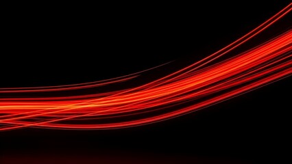 Abstract red light trails on a dark background