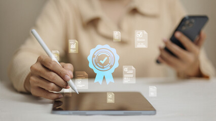 Woman using stylus pen on tablet with guaranteed certificate and approved document icons.