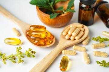 Alternative medicine herbal organic capsule vitamin E omega 3 fish oil drug herbs leaf natural
