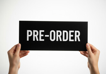 Hands holding "PRE-ORDER" sign on white, promoting upcoming product launch or sale.