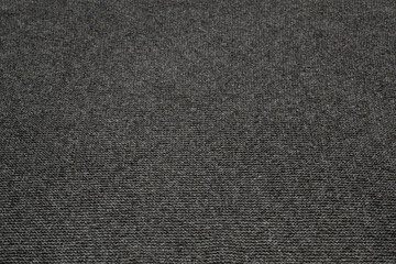 solid dark grey knitted background, texture without a pattern