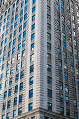 Fototapeta premium Reflective glass background. Architecture. Building architecture. Building background. Glass building window. Architectural detail. Background of architecture. Modern glass background