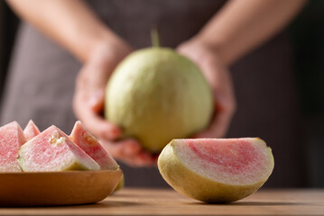 Sliced guava with hand ready to eating, Tropical fruit 
