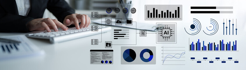 A close-up view of hands typing on a keyboard with a backdrop of data visualization graphics and AI...