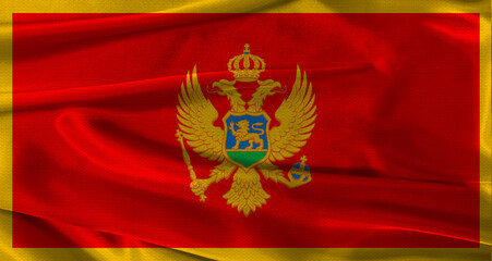 Flag of Montenegro with fabric textured background. Close up of National flag of Montenegro with...