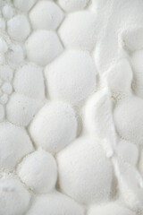 Glass Vial with Liquid Surrounded by Single Use Syringes