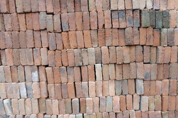 Texture of Stacked Rough Red Clay Bricks