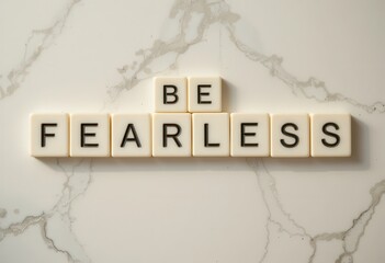 Inspirational Message on Marble Background Featuring 'Be Fearless' Letters