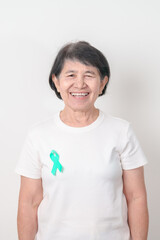 Elderly with Teal Ribbon for September Ovarian Cancer Awareness month, PCOS, January Cervical Cancer, April Sexual Assault, June PSTD, Post Traumatic Stress Disorder, May Tourette syndrome