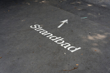 Markierung auf Asphalt mit der deutschen Aufschrift Strandbad in Bregenz am Bodensee in &Ouml;sterreich