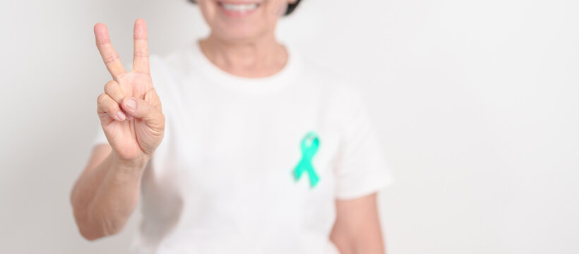 Elderly with Teal Ribbon for September Ovarian Cancer Awareness month, PCOS, January Cervical Cancer, April Sexual Assault, June PSTD, Post Traumatic Stress Disorder, May Tourette syndrome