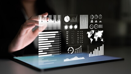 A sleek digital tablet displays a rich set of business analytics with various charts and graphs, aiding professionals in data-driven decision making and strategy development. Impute