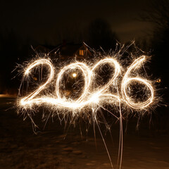 Creative light painting of 2026 using sparklers for New Year festivities.