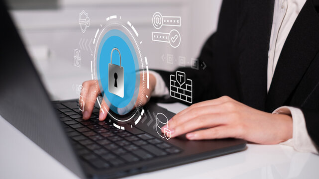 Businessman online digital remote working laptop computer with shield padlock lock password, cybersecurity and data information protection access firewall concept