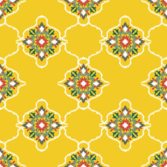 Green and yellow ikat abstract seamless pattern. Ikat oriental design pattern. Ikat, Victorian, or Baroque styles. Ikat ethnic pattern. Design for textiles, rugs, tiles, ceramic pottery, and tapestry.
