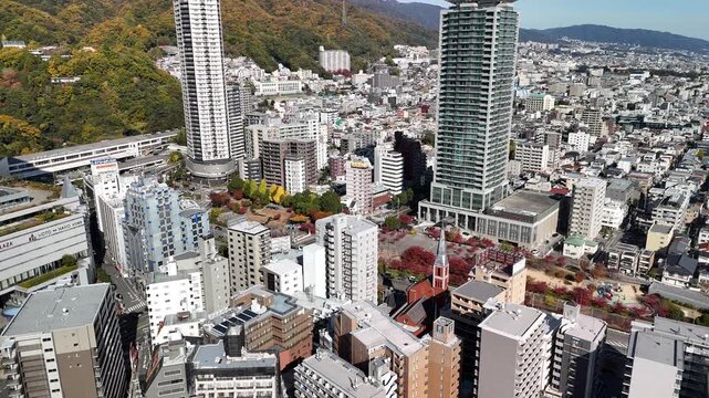 Kobe, Hyogo, Japan in Autumn &ndash; Stunning 4K Aerial Drone Footage of Ikutagawa River, Cherry Tree Avenue, Canal, City Skyline in Chuo Ward, Urban Streets and Rokko Mountain Range