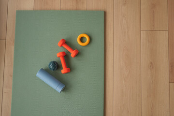 Fitness equipment on a mat in a workout space