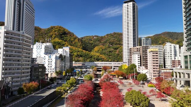 Kobe, Hyogo, Japan in Autumn &ndash; Stunning 4K Aerial Drone Footage of Ikutagawa River, Cherry Tree Avenue, Canal, City Skyline in Chuo Ward, Urban Streets and Rokko Mountain Range