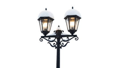 Snow-covered vintage street lamp with glowing lights on a transparent background, PNG image, PNG file