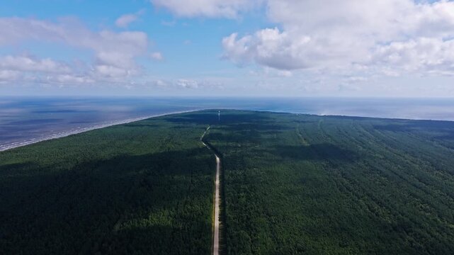 Vertical ascent, Kolka nature with drifting cloud shadows sliding across forest