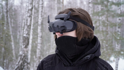 FPV drone operator, close-up, face with glasses