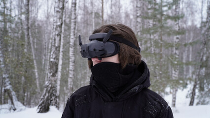 FPV drone operator, close-up, face with glasses