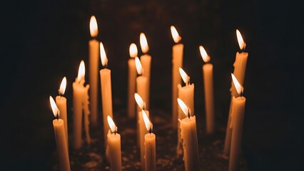 Lit Candles Group in Dark Environment, Close-Up View of Flickering Flames for Spiritual and Calm Atmosphere