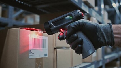 Close up of warehouse worker hand using barcode scanner on cardboard box parcel, logistics shipping and e-commerce delivery service concept. - Powered by Adobe